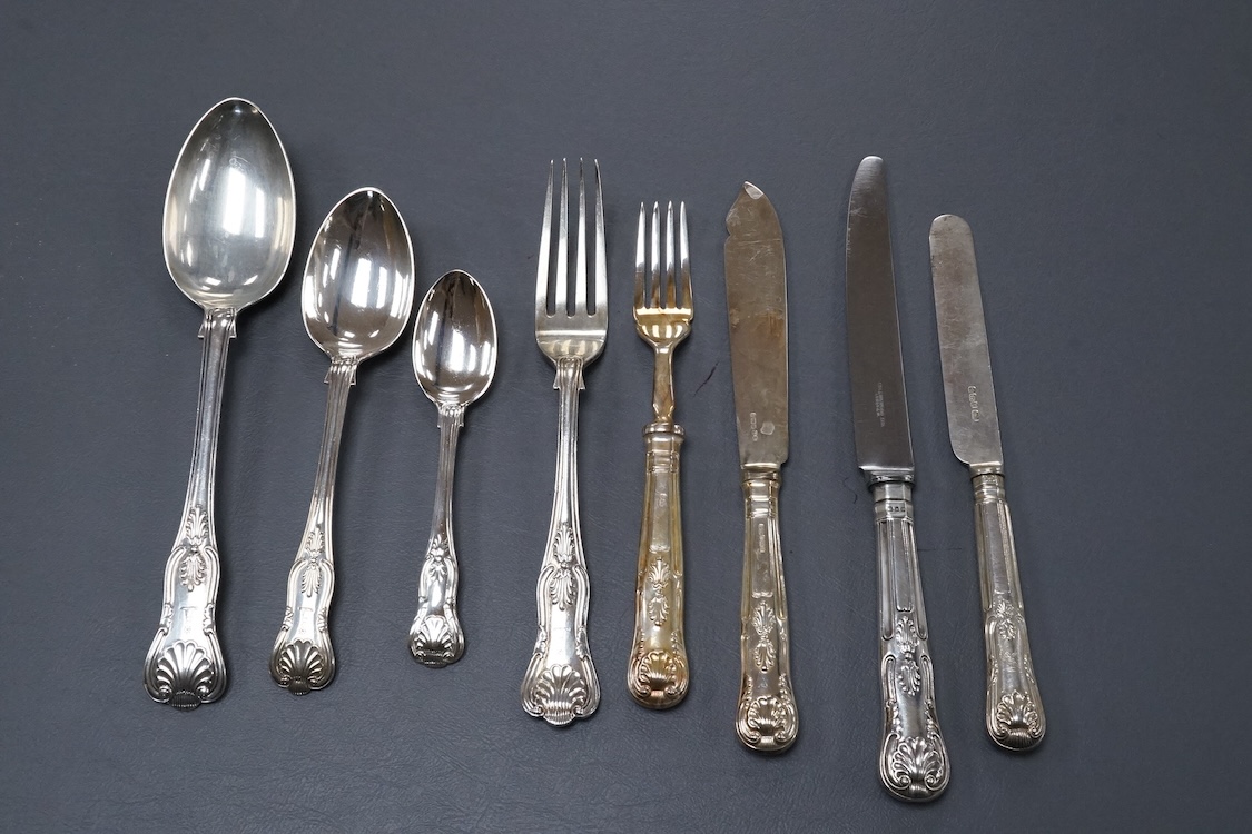 A harlequin part canteen of late 19th/early 20th century silver King's pattern flat ware, comprising eight table spoons, nine dessert spoons, two table forks, one dessert fork and two coffee spoons, by James Dixon & Sons